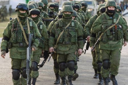 Military-personnel-believed-to-be-Russian-servicemen-walk-outside-the-territory-of-a-Ukrainian-military-unit-in-the